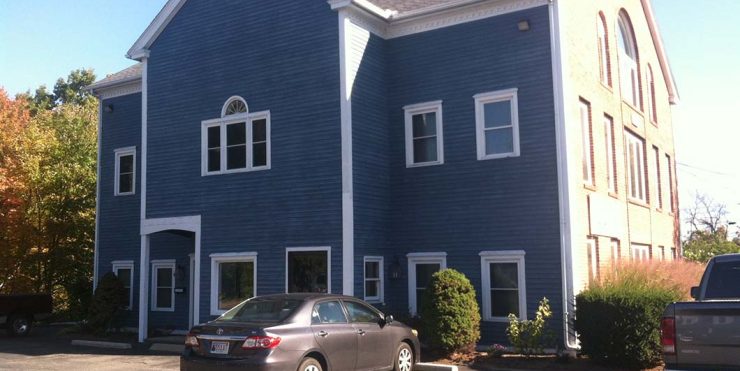 grafton pic A car parked in front of a blue building.